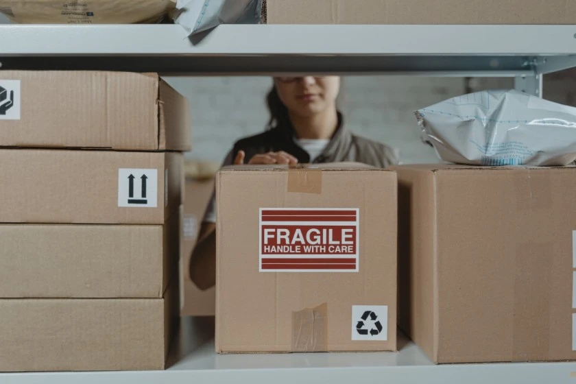 Deliver man with fragile delivery box - Amazon returns
